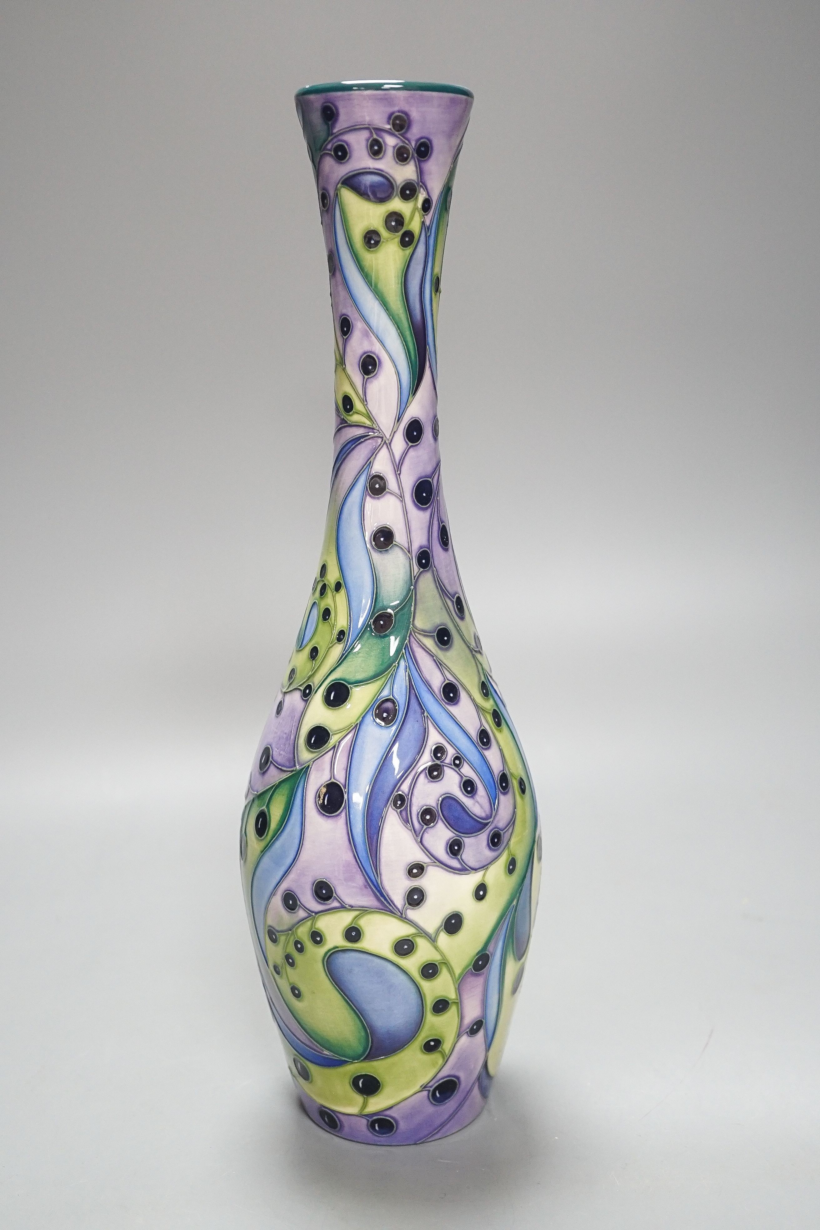 A Moorcroft bottle vase, stylised berries 31cm